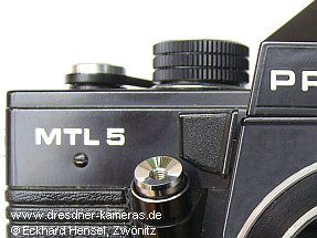schwarze Deckkappe Praktica MTL 5 (abgebildete Kappe ist echt, Kamera jedoch nicht original)