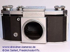 Praktica, nachgerstete Blitzsynchronisation 1 DIN-Buchse (Praktica, Versionen mit angegossenen Tragesen und mit eingeschraubten Tragesen) Importeur: Kine Camera Co. a Division of Ocean Photo Supply Co. Inc., 11 West 20th Street, New York 11, N.Y.